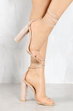 Wicked Nude String Up Lucite Heels.